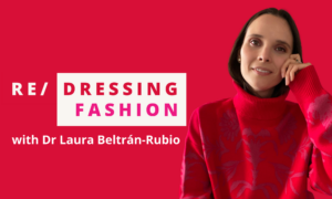 Banner with the text "Re/dressing fashion with Dr Laura Beltran-Rubio". A photo of Laura is on the right. She is a brunette with hazel eyes, wearing a turtleneck sweater with a Renaissance-inspired floral pattern in purple and red.